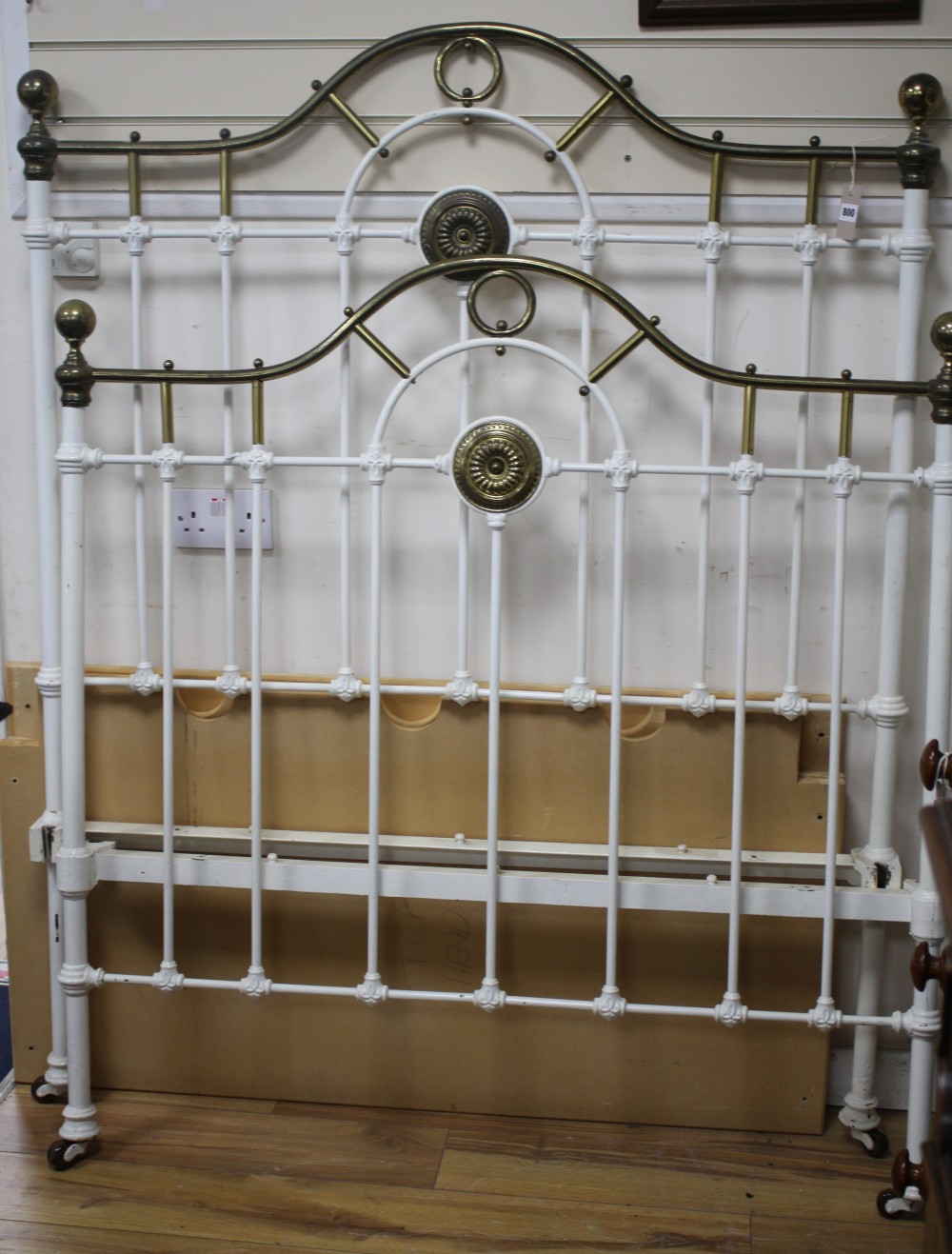 An Edwardian white painted iron and brass bedstead, W.121cm H. headboard 160cm footboard 128cm, L.190cm approximately